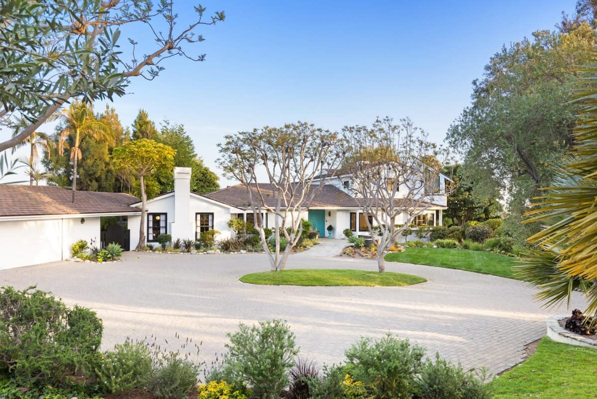 Large circular driveway past the entry gate.