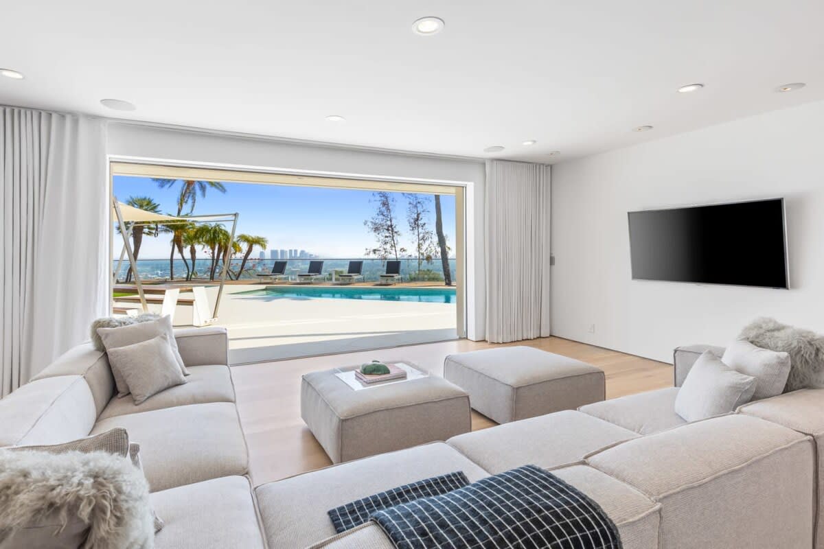 Relax in the Living room space overlooking the pool