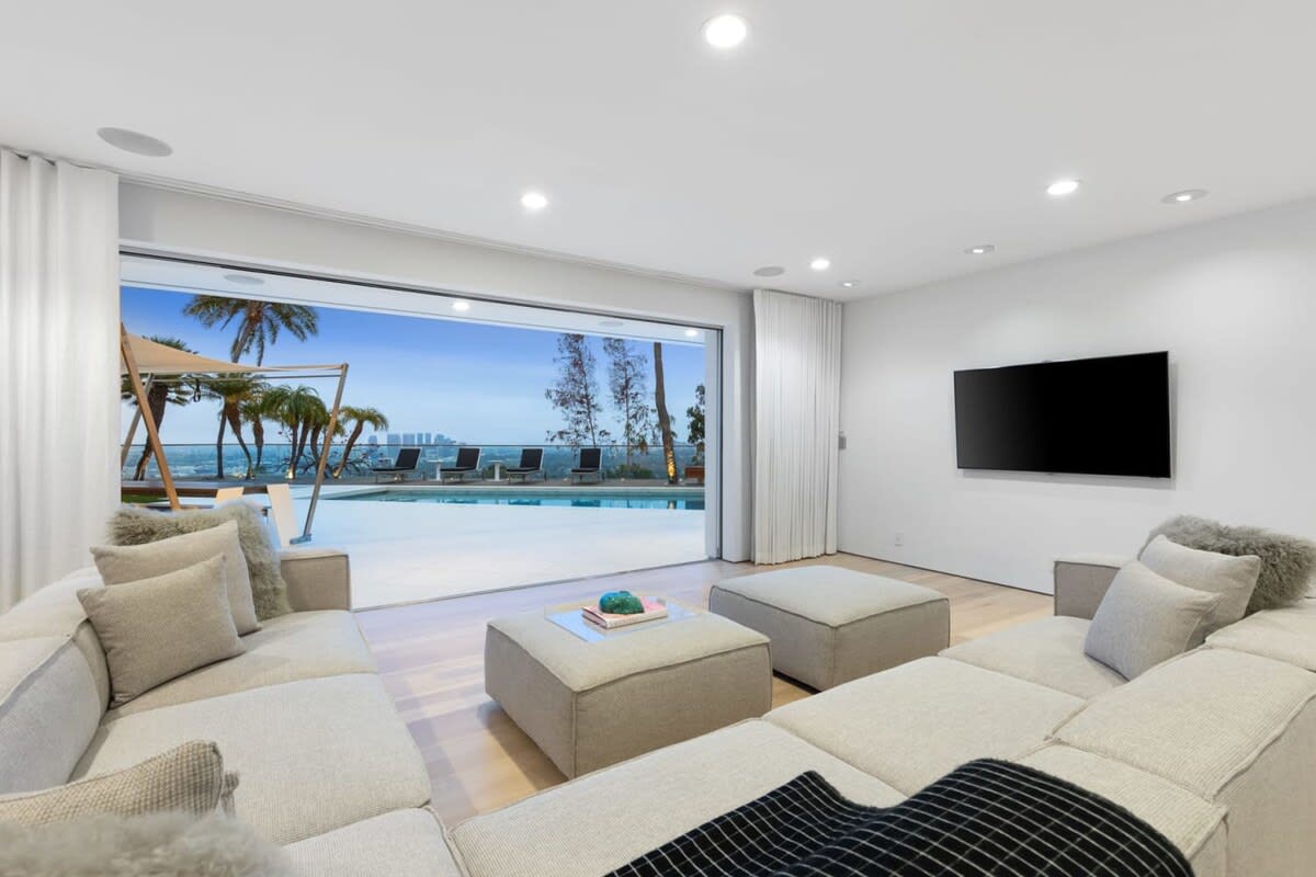 Second Family Room with views of the pool and the city in the distance