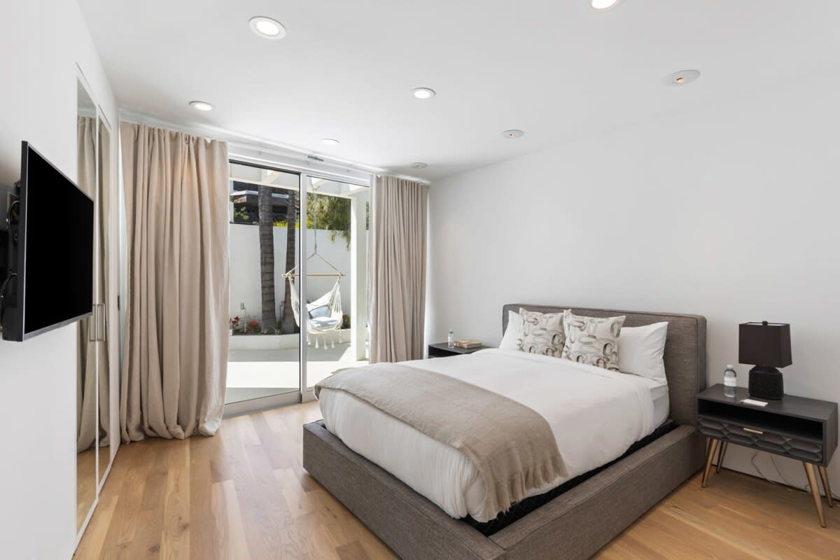 Relax on the ultra-comfortable bed in the Guest Bedroom 2