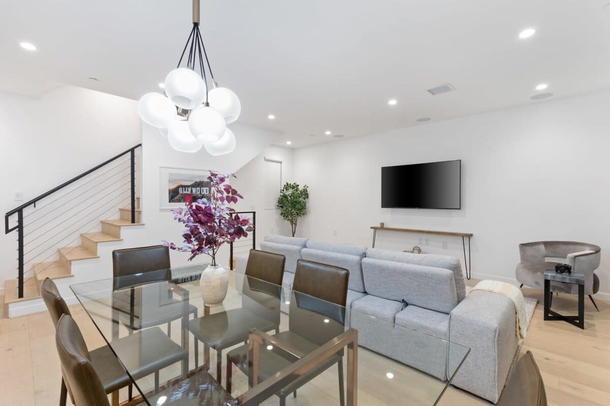 Take a seat at the 6-person Dining Space, with additional 3 counter bar stools