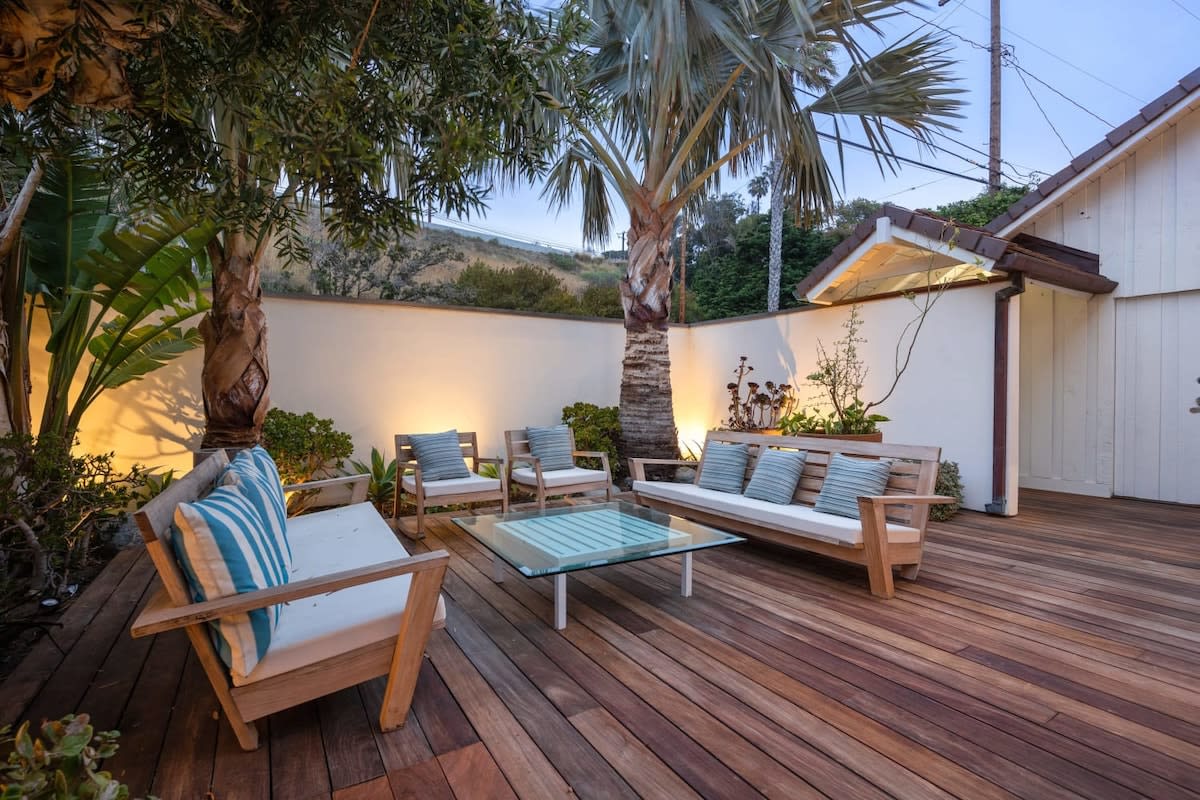 As the sun sets, lounge in the outdoor space and cheers to a wonderful vacation!