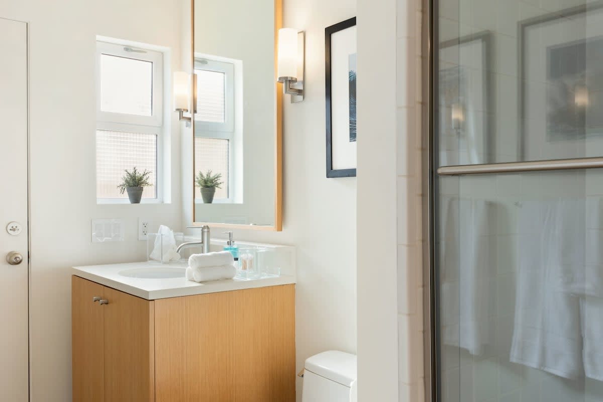 Each bathroom comes sparkling clean and fully equipped with conditioner, shampoo, and toiletries.