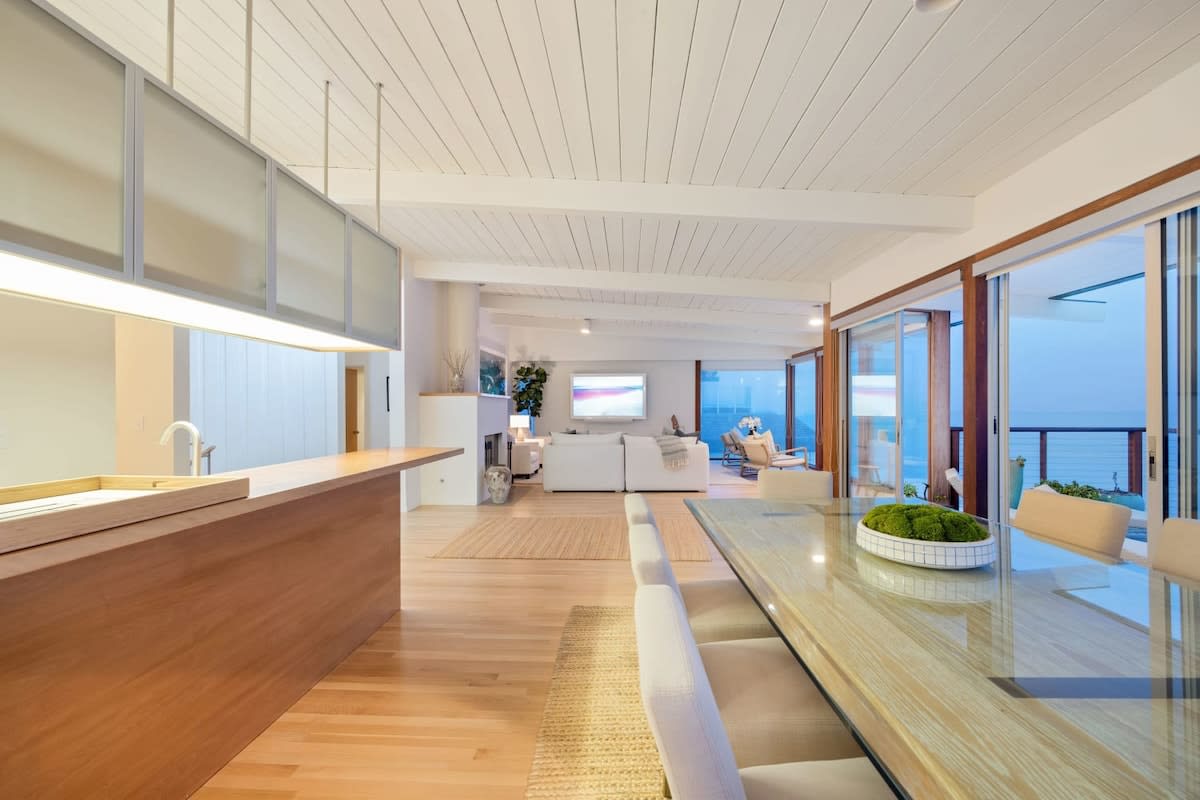 If the evening air becomes chilly, move inside to the expansive dining table next to the kitchen.