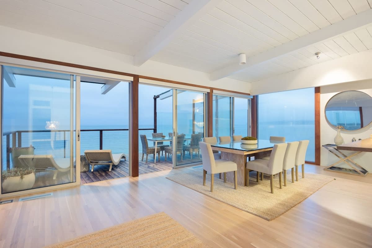 The lovely indoor-outdoor space is perfect for a dinner party.