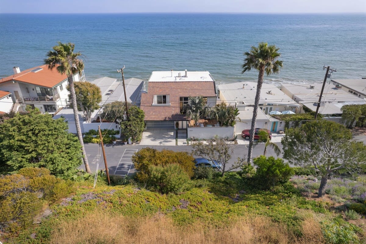 Breathtaking beachfront vacation home with convenient beach access for your enjoyment.