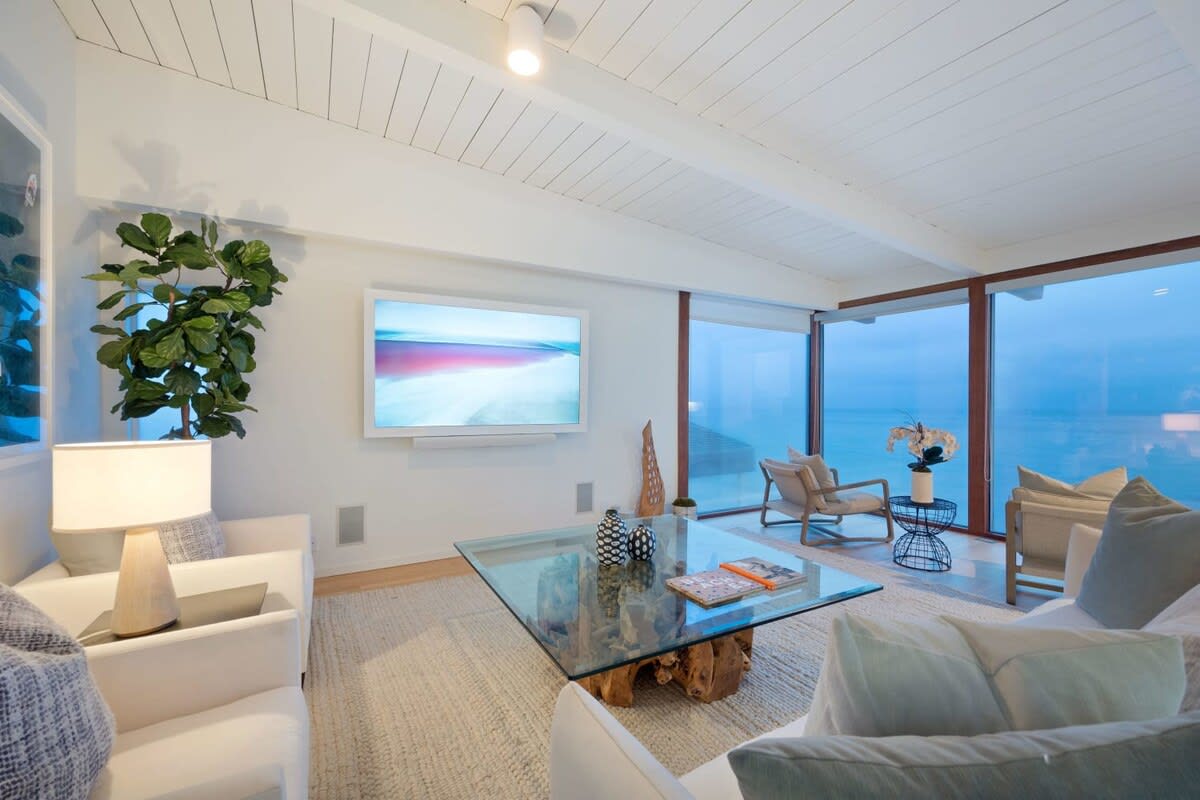 Cosy soft lights create a calm setting with a crackling fireplace in the background.