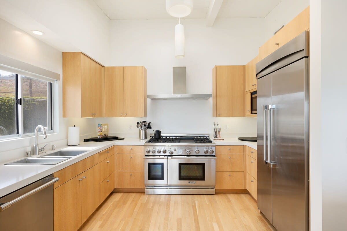 Step into the spacious kitchen, complete with state-of-the-art appliances and plenty of natural light.