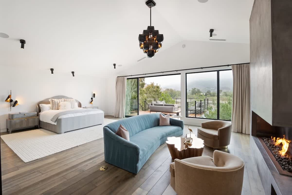 The spacious primary suite features a large walk-in closet and incredible views.