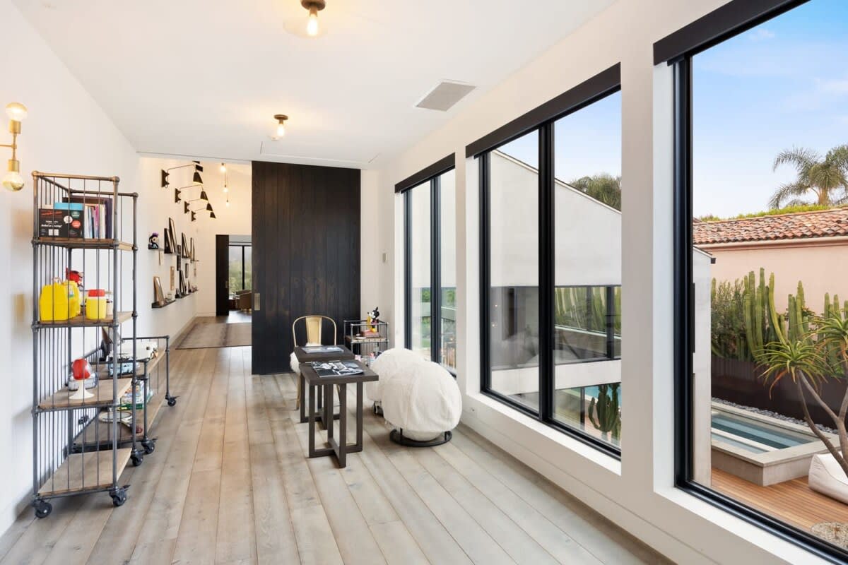 Large windows allow for plenty of natural light and views of the pool.