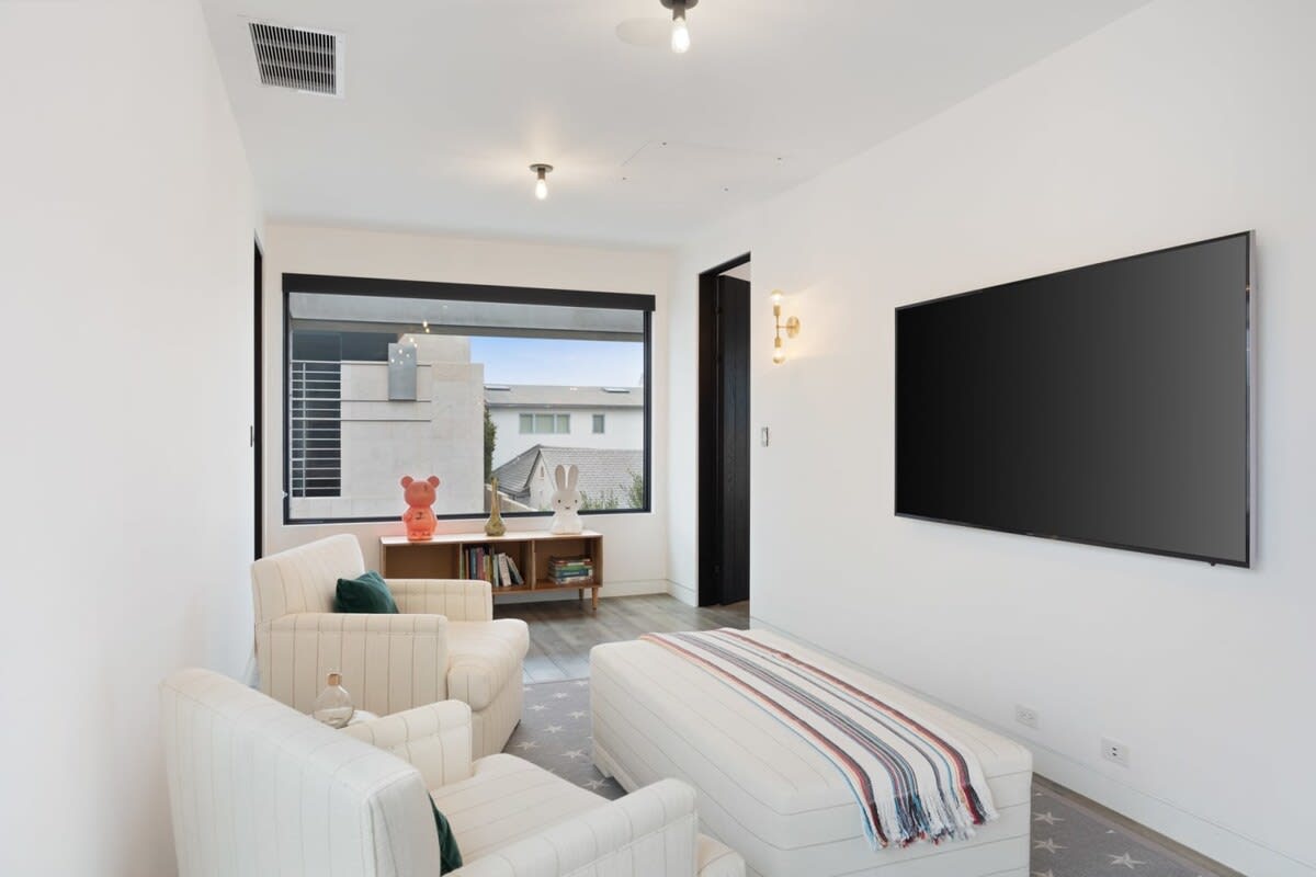 Sit back and unwind in front of the flat-screen TV.