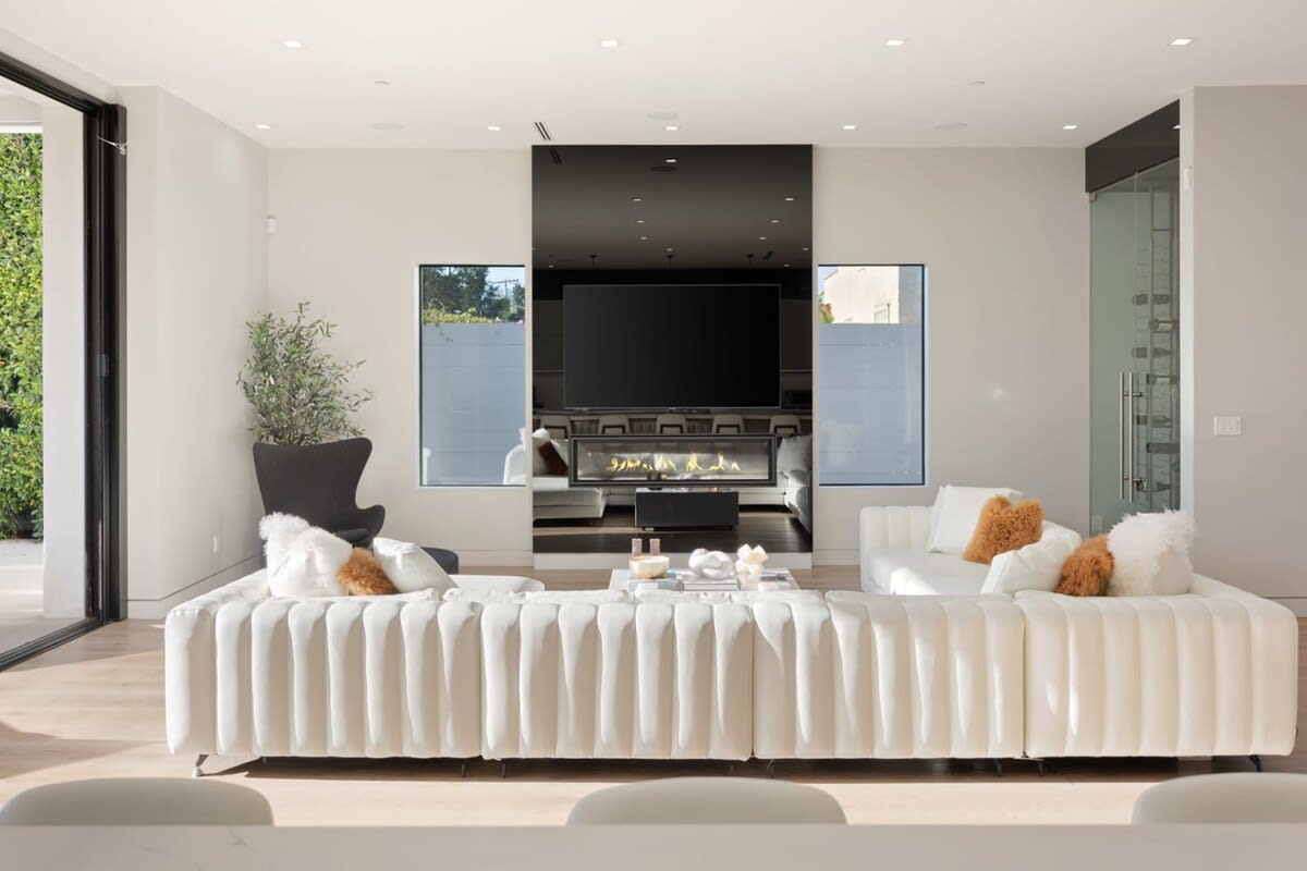 Living room with flat screen tv and modern fireplace