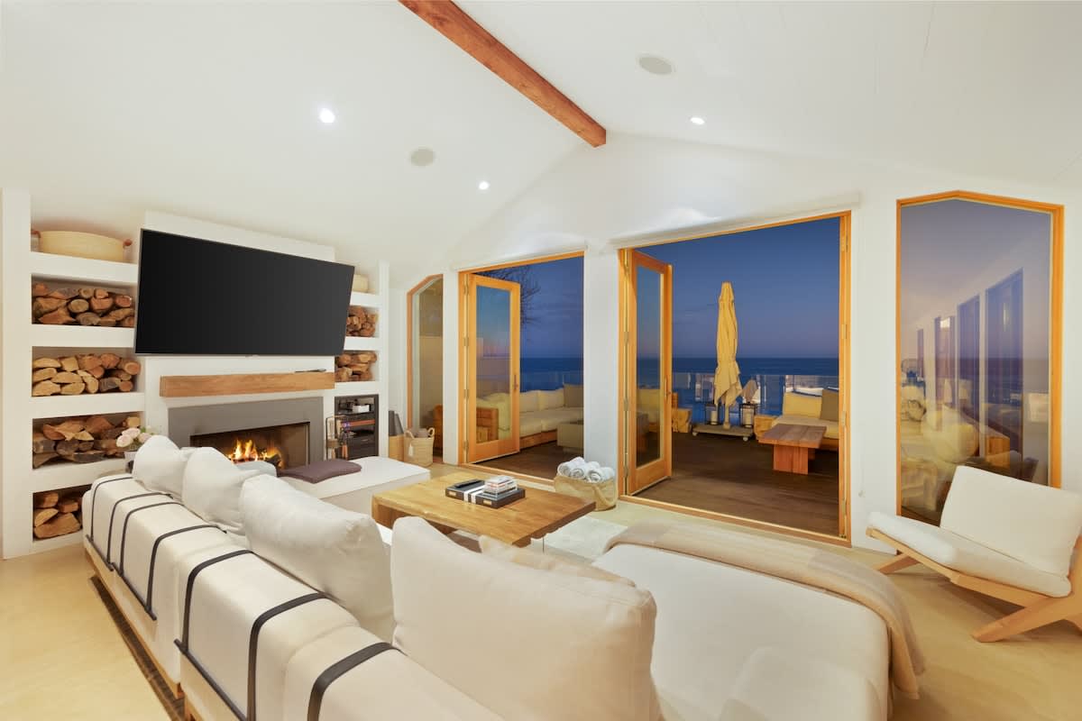 Let the evening ocean breeze cool the living room on a summer night.