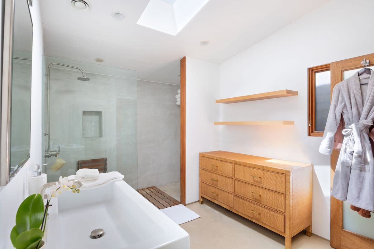 Expansive bathroom featuring an invigorating shower and abundant natural light streaming in through the skylight.