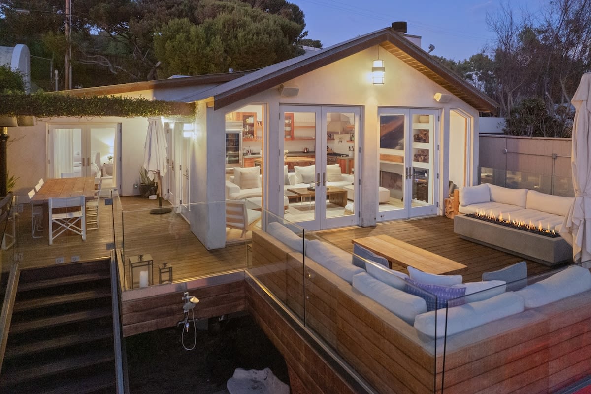 Plenty of outdoor seating on a large beachfront deck.