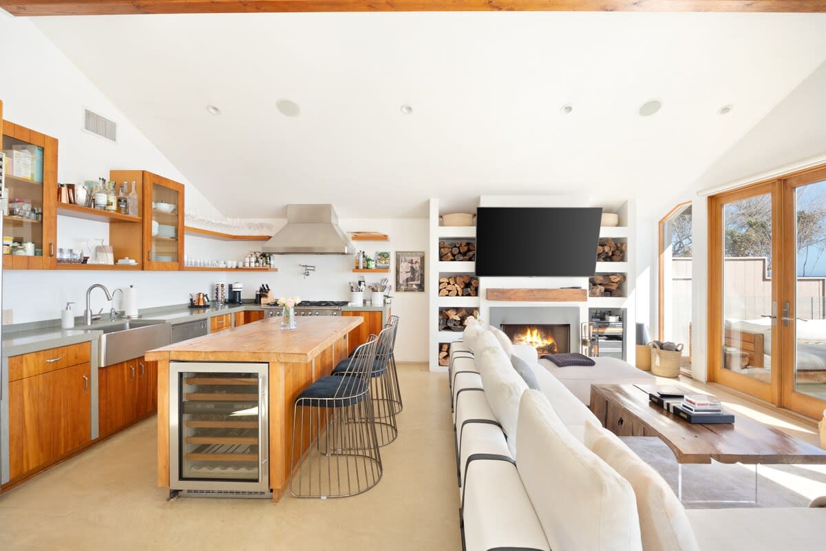 A stunning open faced kitchen with wooden features.