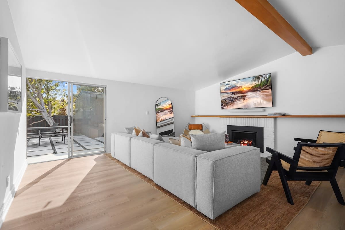 Large flatscreen Smart TV in the living room. We spare no expense when it comes to design. We use the highest end furnishings to inspire all of your interior design desires.