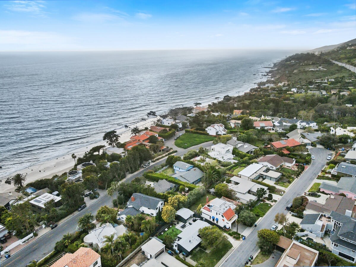 Nestled on a quiet street in a beachfront community just off of PCH