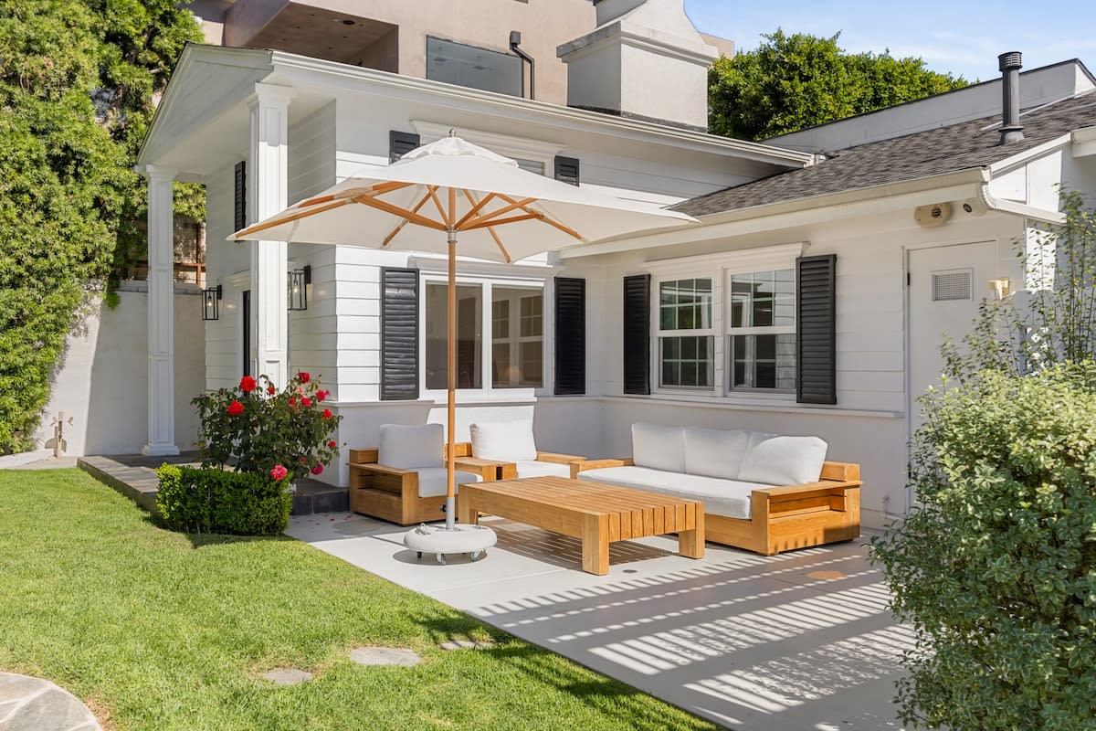 Bask in the sunlit serenity of the outdoor lounge area, a perfect spot for relaxation and warmth.