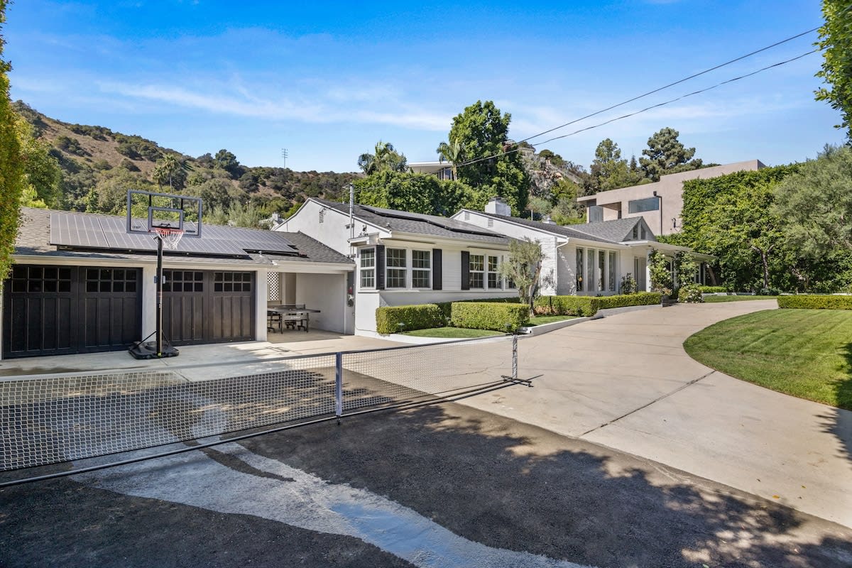 Step into a versatile play zone equipped with an extended tennis court and a basketball net.