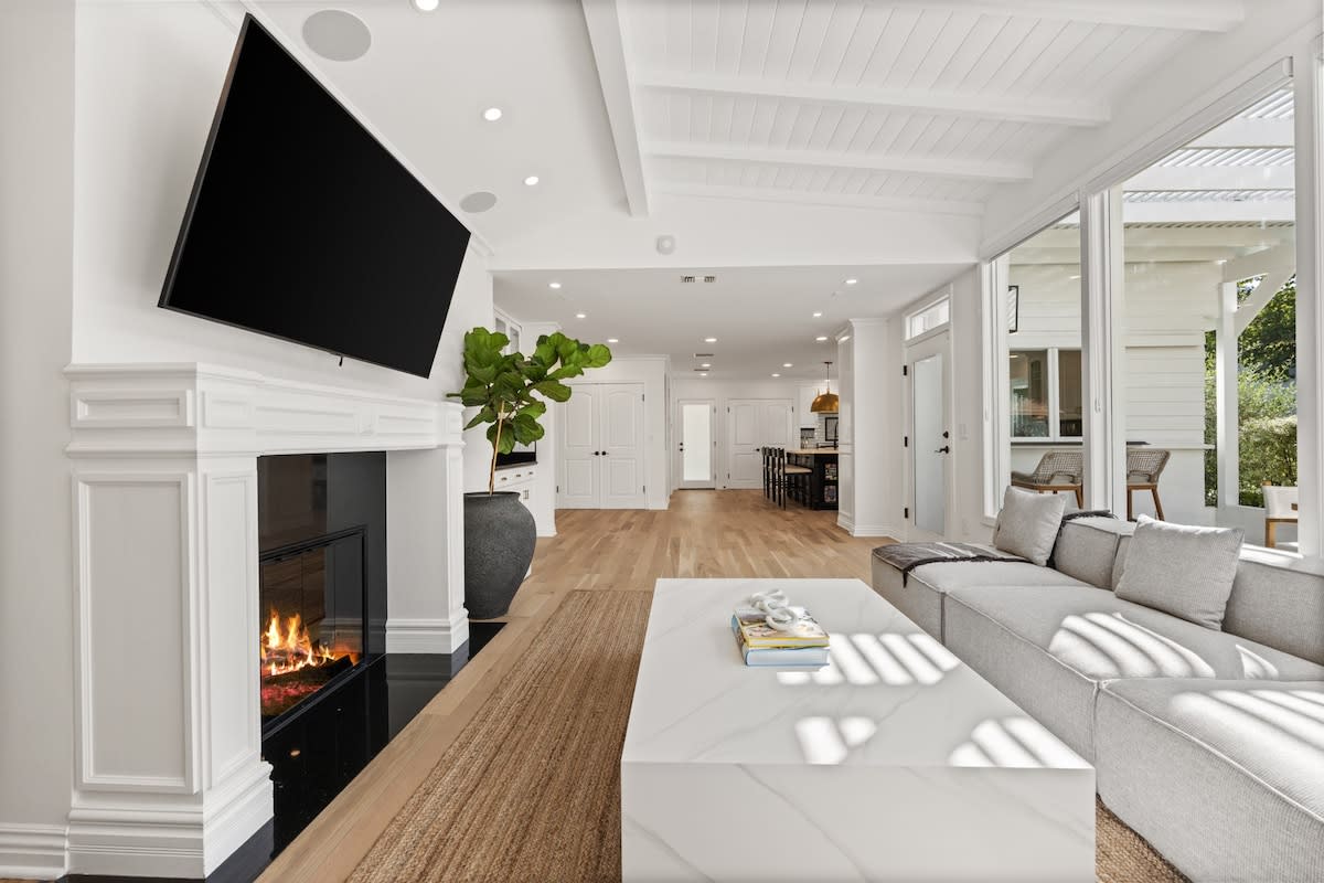 The lounge beckons with a massive TV, creating a haven for relaxation and entertainment.