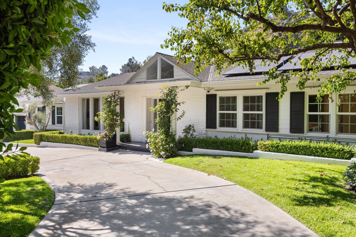 Enter a natural embrace at the front entrance, where the landscaping imparts a refreshing and charming ambiance.