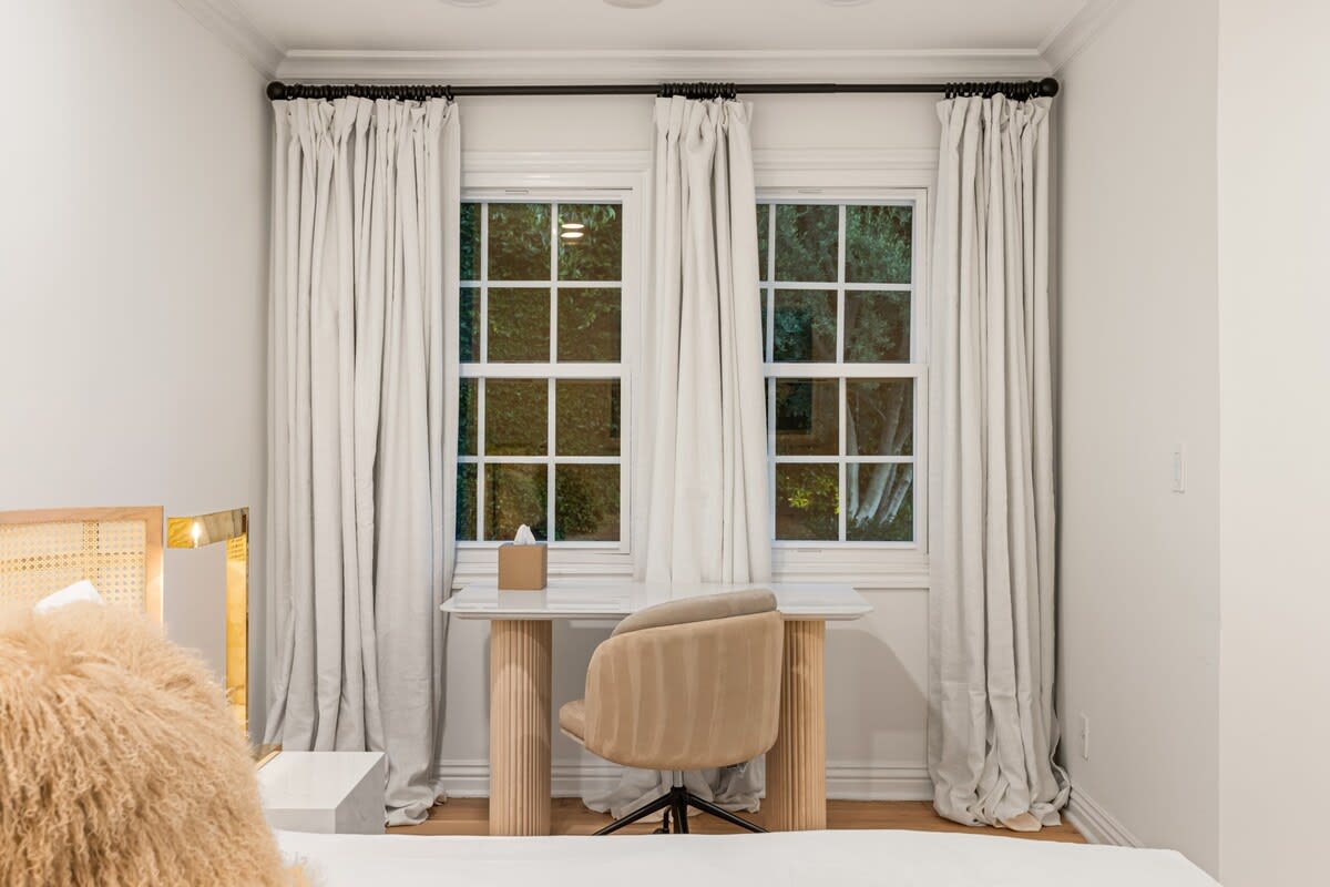 Combine work and relaxation in a bedroom with dedicated desk space and high-speed internet.