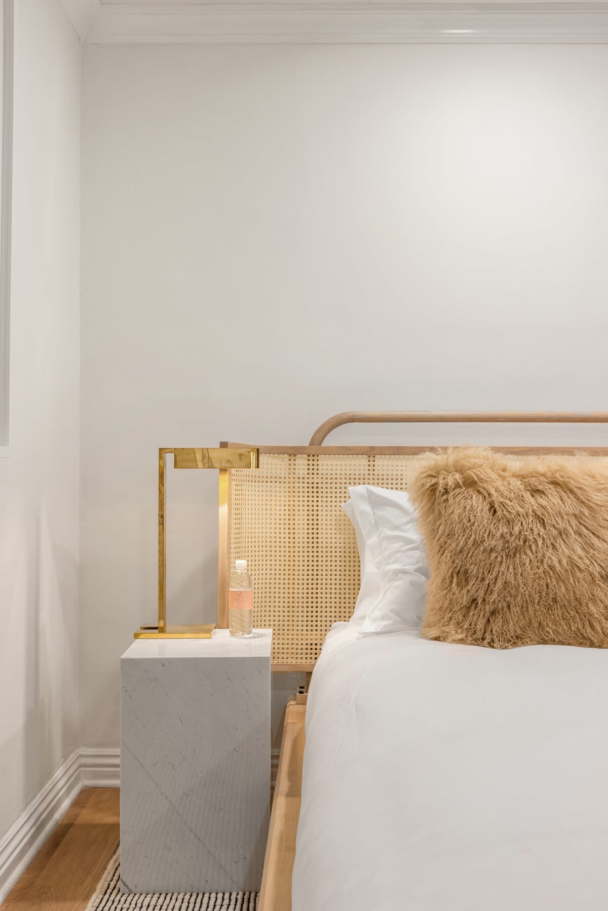 Enjoy elegant slumber in this bedroom with soft, high-quality linen, ensuring a night of pure comfort.