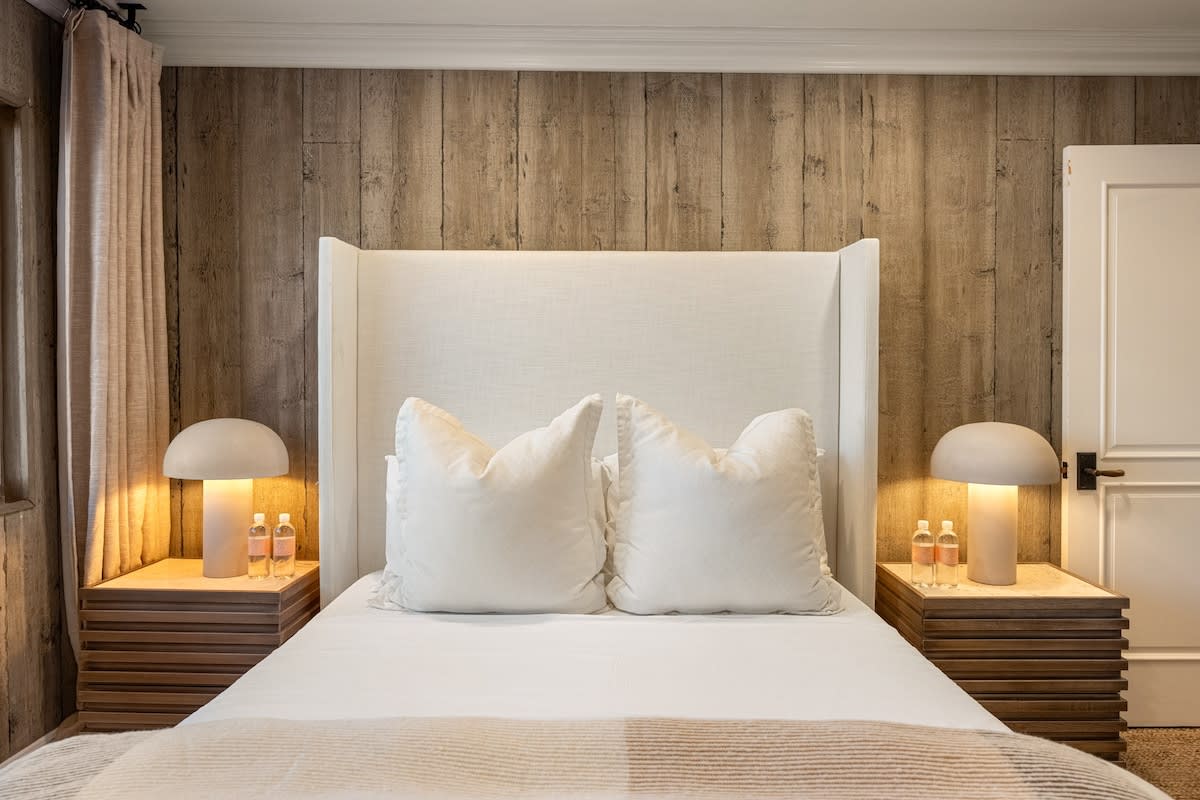 Retreat to the bedroom, where coastal comfort invites peaceful slumber.