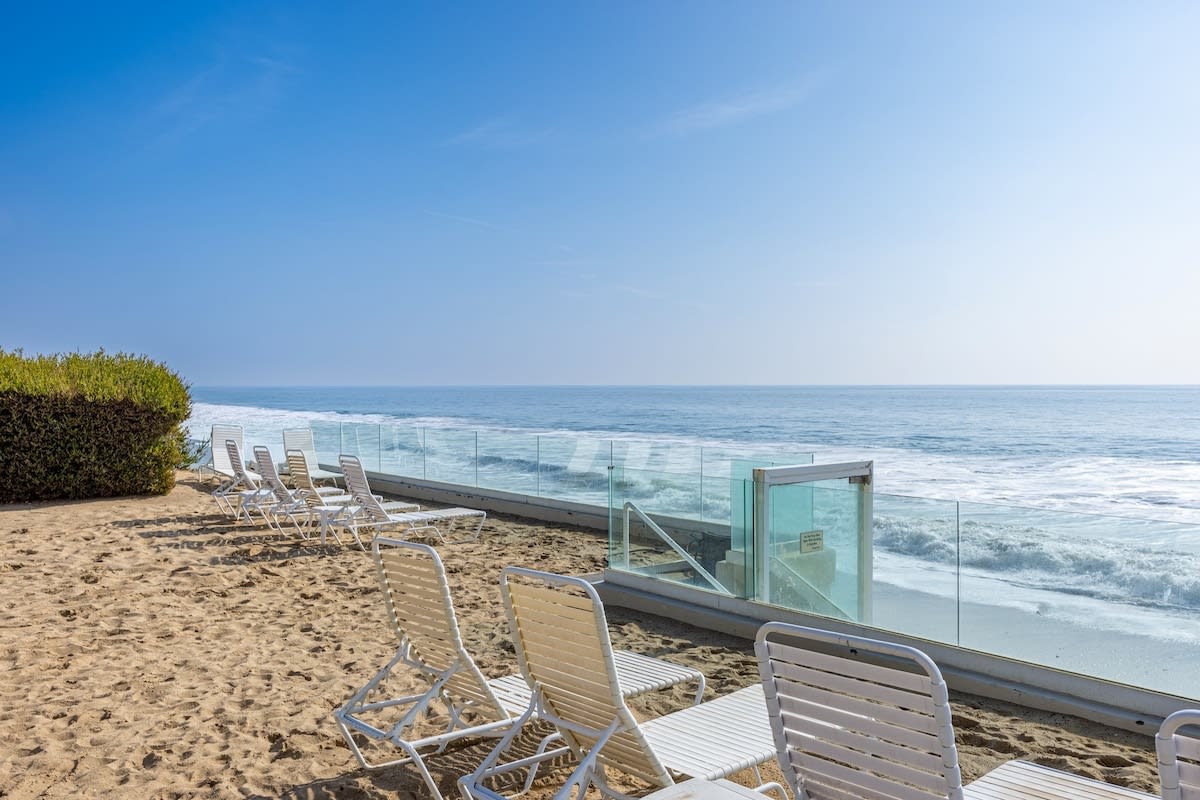 Recline in beachfront serenity on the comfortable outdoor lounge chair, where the rhythm of the waves becomes your soundtrack.