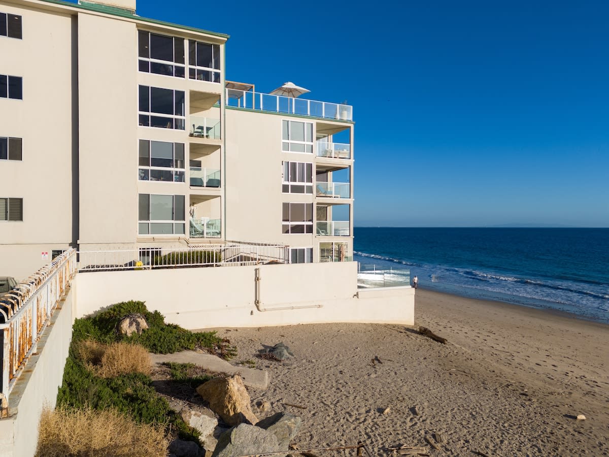 Private beach access accompanied by stunning ocean views and the soothing sound of waves.