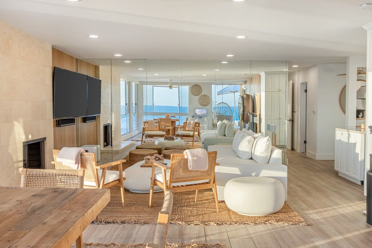 Refined simplicity meets panoramic serenity in this sunlit living space.