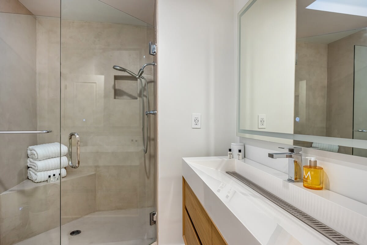Revitalize in the ensuite bathroom, adorned with a bidet, large bathtub, and hotel-style amenities.