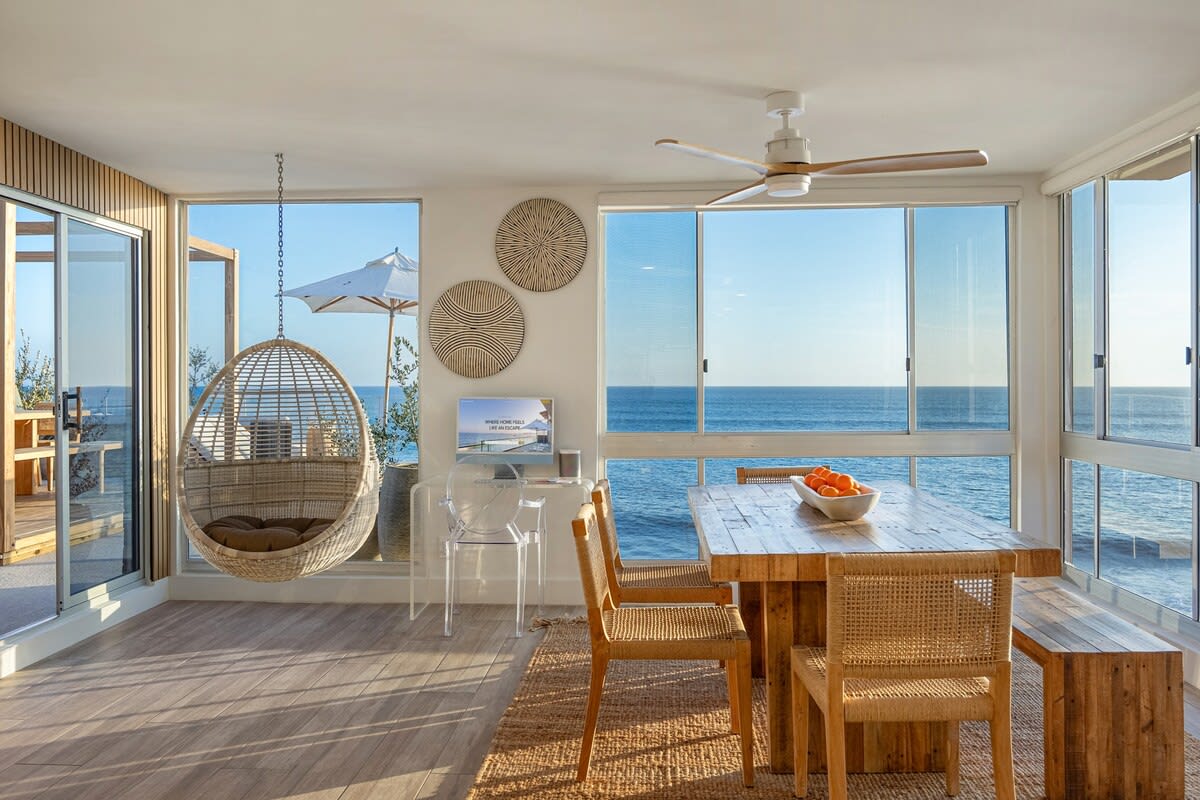 A tranquil coastal sanctuary with designer furnishings and front-row Pacific views.
