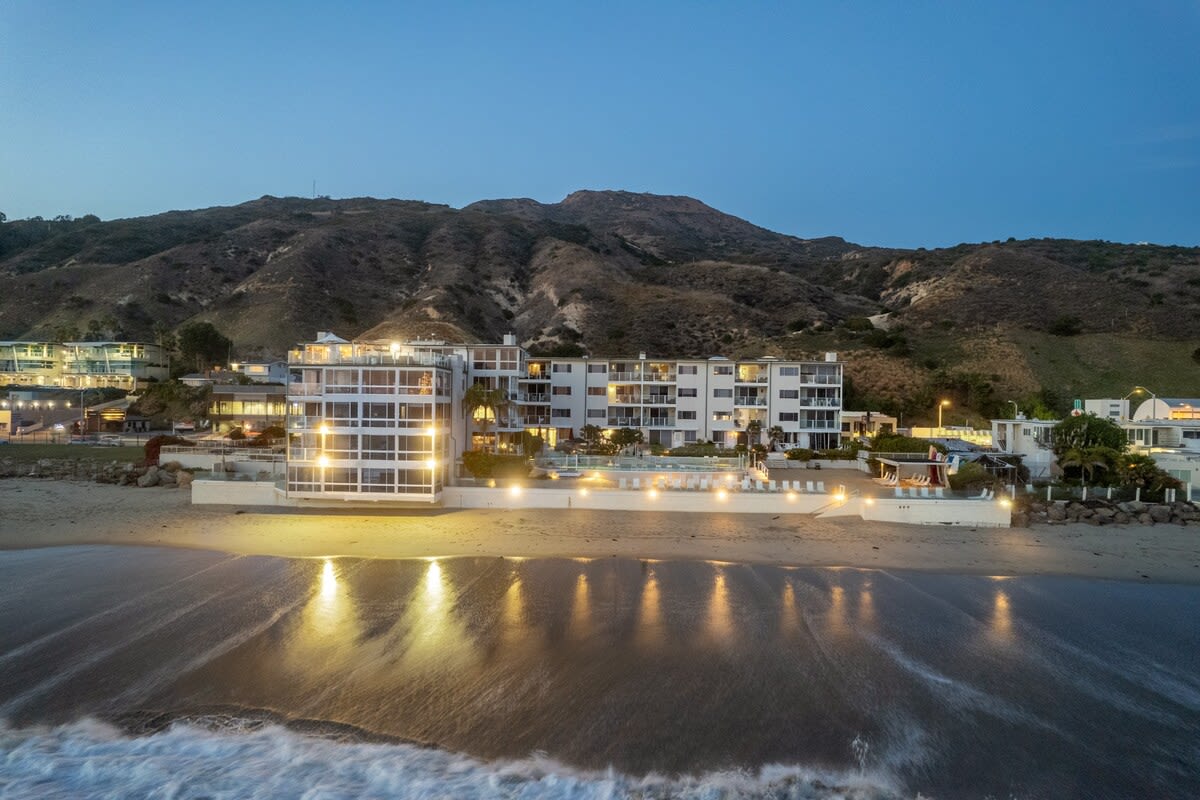 Experience the magic of Aqualina's location with a bird's-eye view of the beach at night—a serene escape in the heart of Malibu.