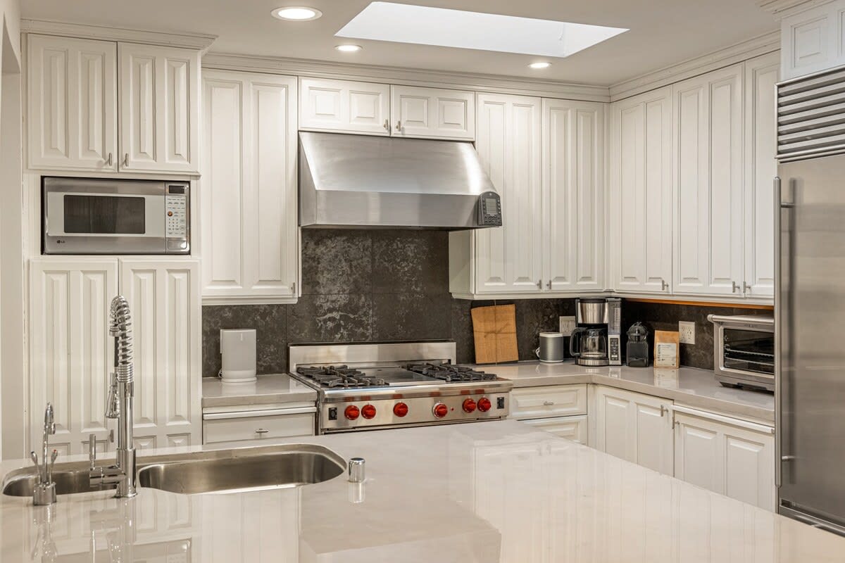 Step into culinary luxury in the well-appointed kitchen, where modern design meets functional elegance.
