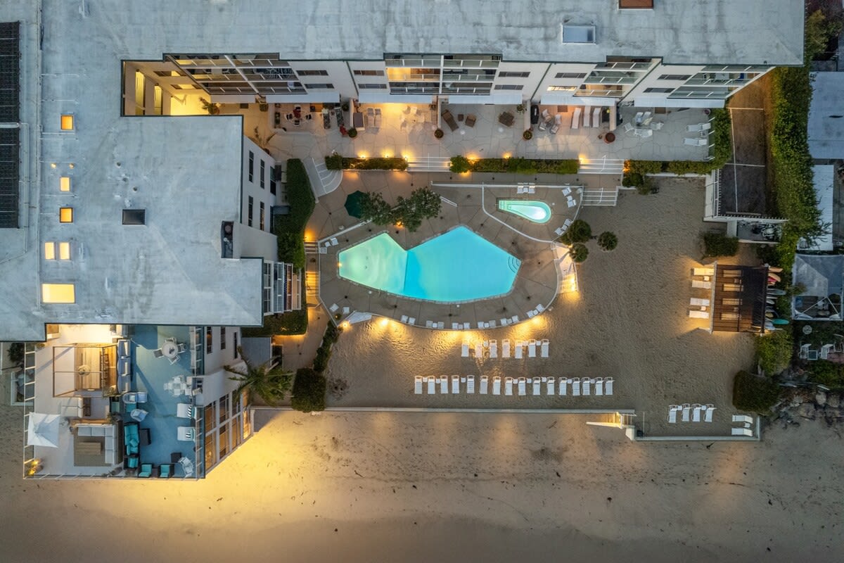 Embrace the ease of beachfront living with direct access, where sandy shores meet your doorstep.