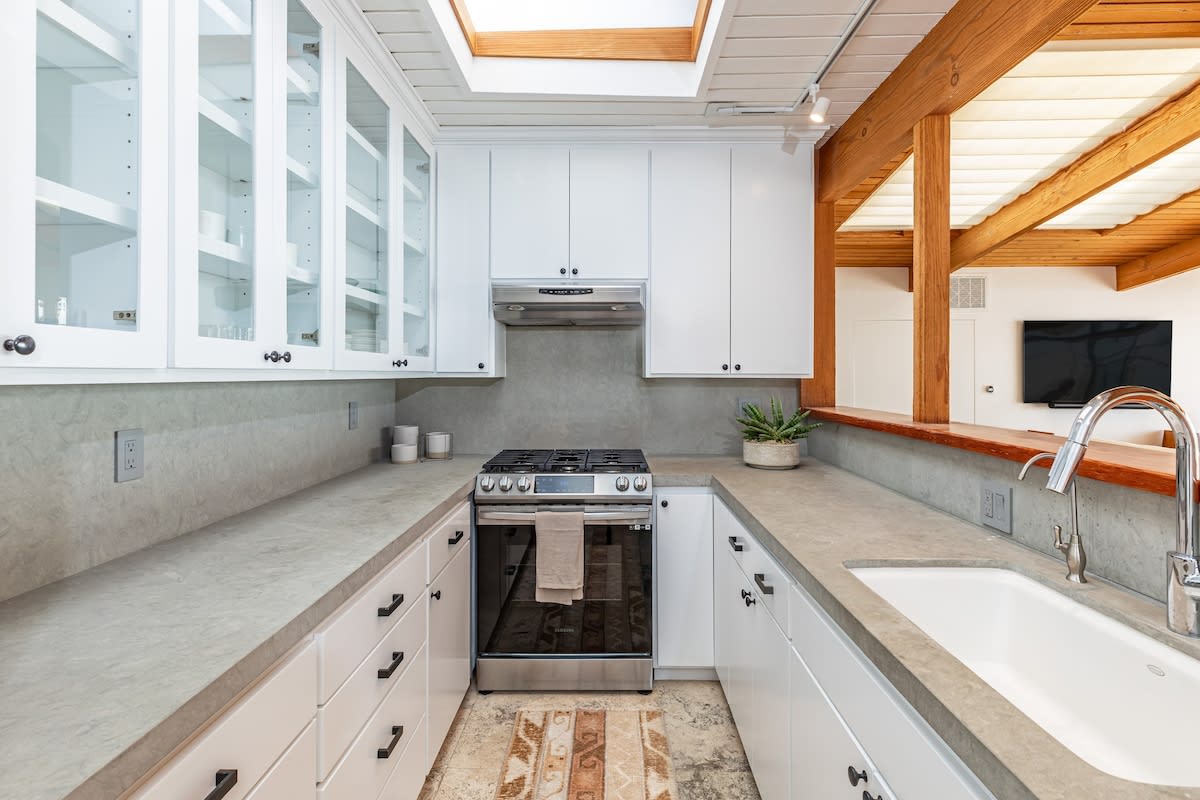 Embrace ocean views in the open kitchen, equipped with high-end appliances and a Nespresso coffee system for a touch of luxury.