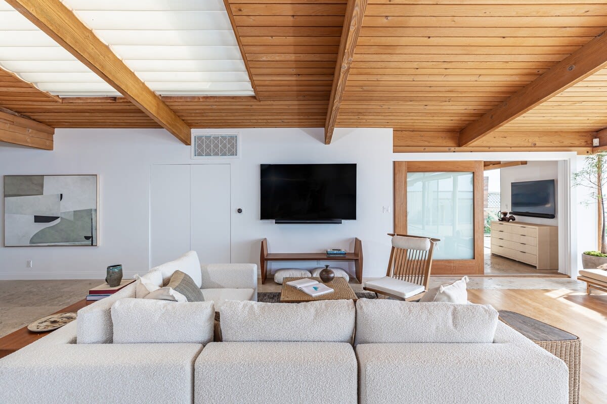 Discover calmness in the comfortable Bedroom, boasting a king-size bed, blackout window treatments, and a smart TV with a Sonos Sound Bar.