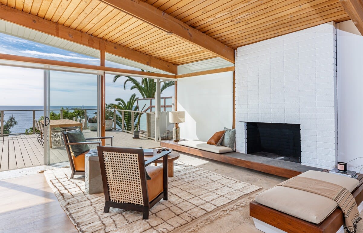 Cozy up to the gas fireplace in the living room, where warmth and ambiance create an inviting haven for tranquil moments.
