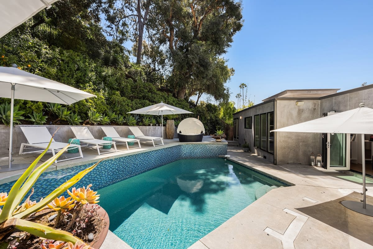 Refresh and unwind under the California sun in the tranquil oasis of the pool at the Beverly Hills Canyon Villa.