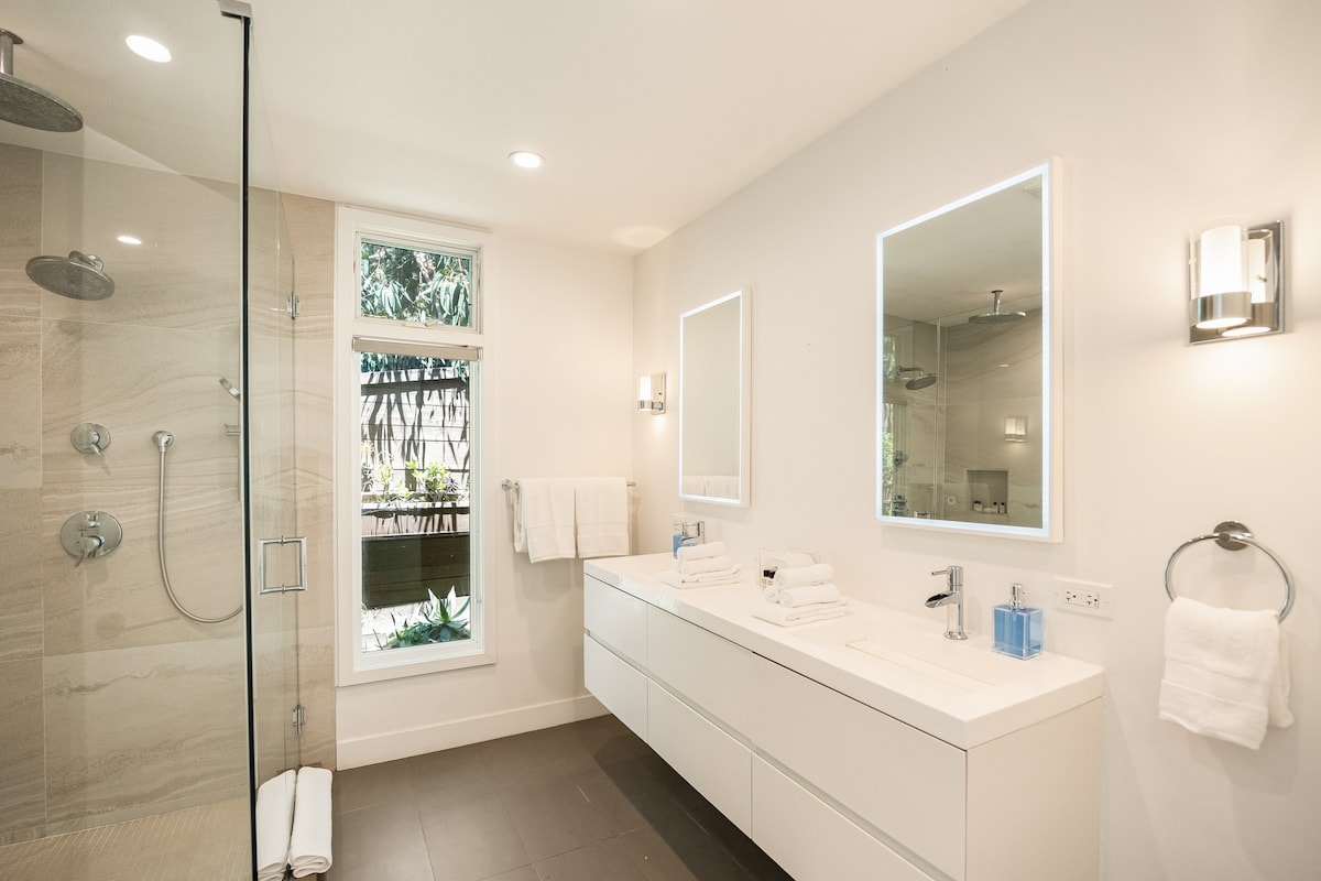 Indulge in luxury in the beautifully appointed bathroom, complete with a shower and all the essential amenities for a comfortable stay.
