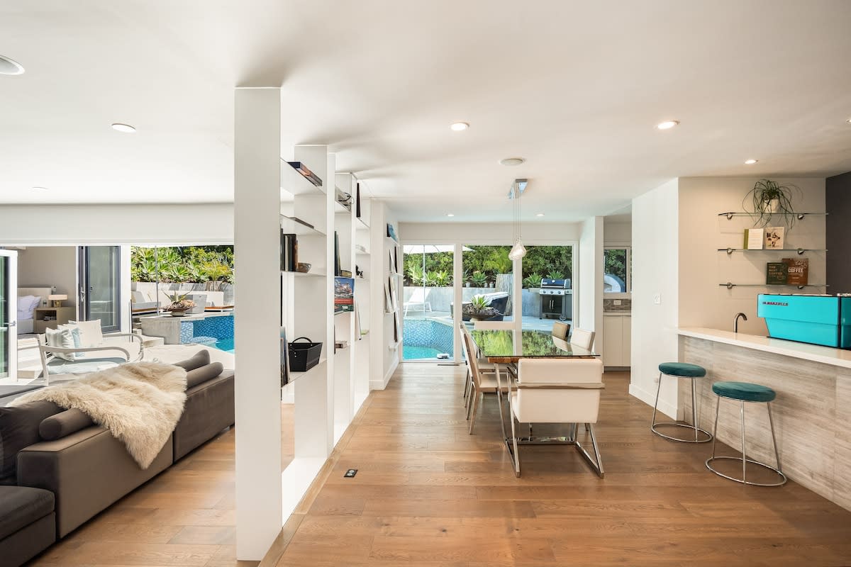 Seamlessly blending, the dining area in the open living space offers an elegant setting.