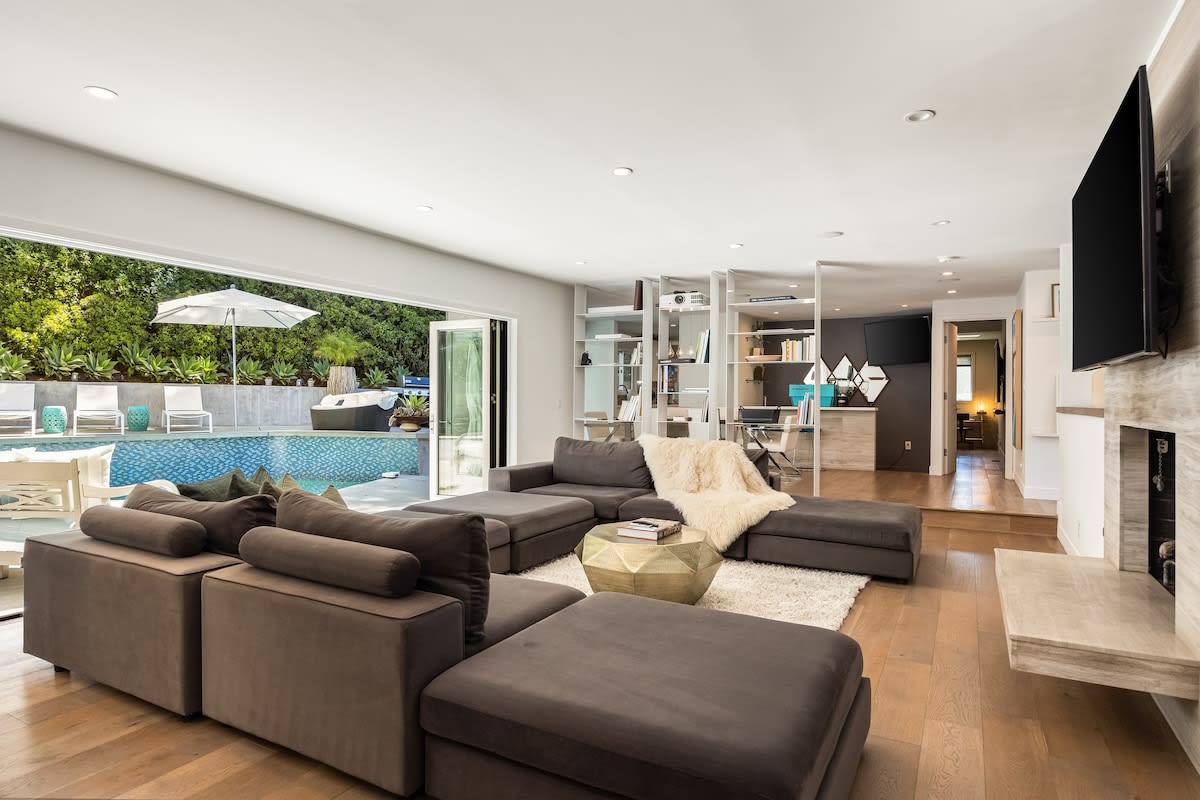 The sunken living room exudes comfort and sophistication with stylish décor.