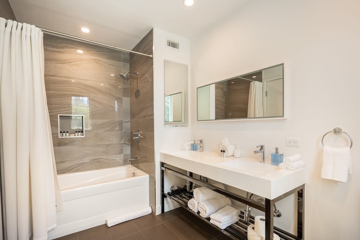 Indulge in luxury in the beautifully appointed bathroom, complete with a shower, tub and luxury essentials.