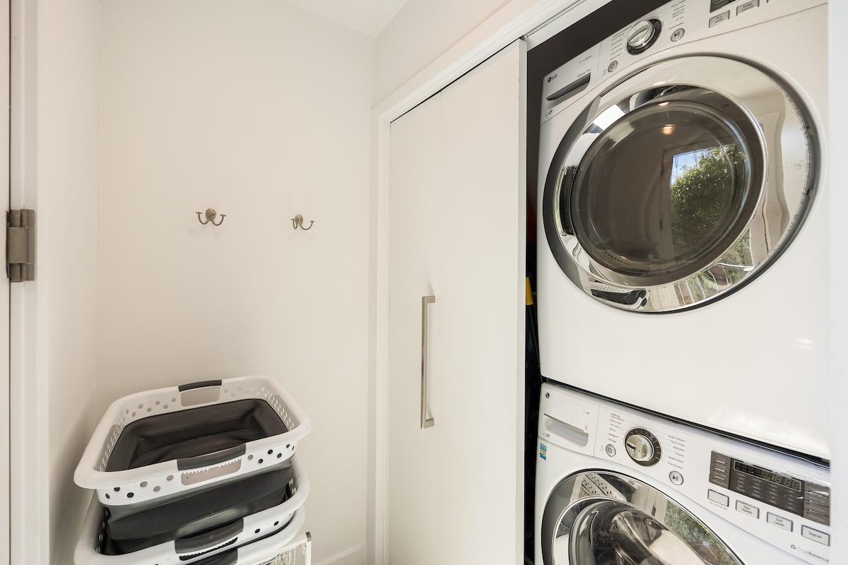 Dedicated laundry room equipped with a modern washer and dryer.
