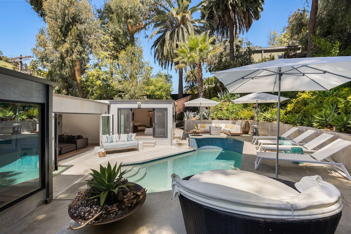 Abundant outdoor furniture, offering ample space for relaxation and enjoyment.