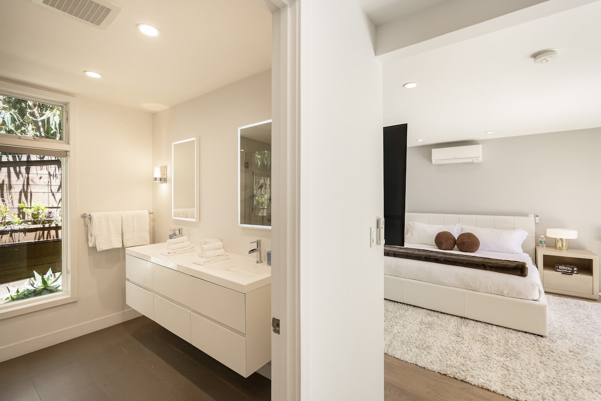 Refresh in the elegant ensuite bathroom, featuring modern amenities and sophisticated decor.