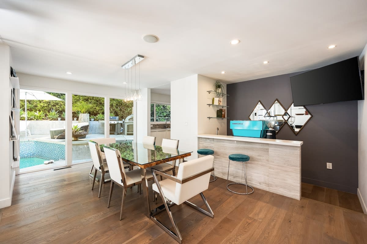Dine in style at the elegant table, surrounded by chic decor and soft lighting.