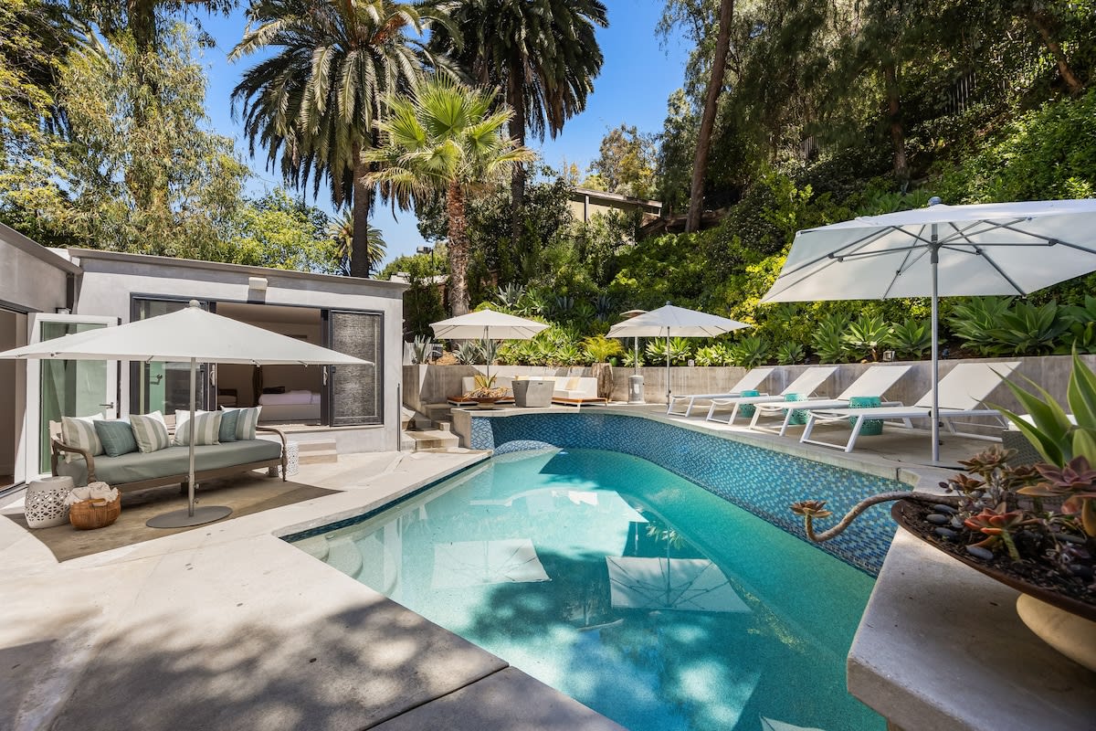 Beckoning with sparkling waters, the pool provides a welcome escape from the heat on sunny days.